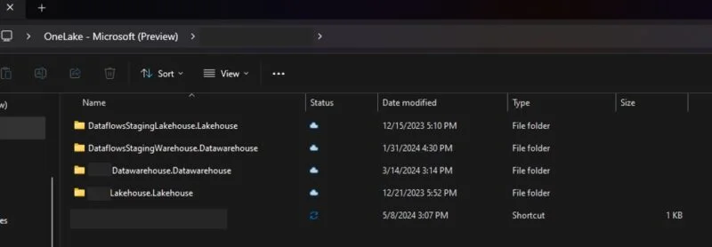 OneLake file explorer in Windows showing lakehouse and warehouse folders